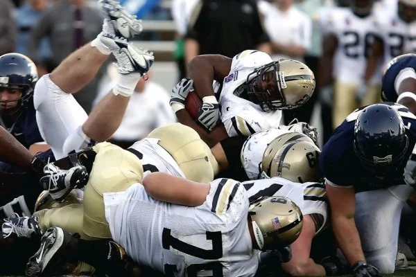 American football stadium game action